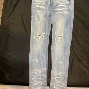 Blue Skinny Jeans with Distressed Style